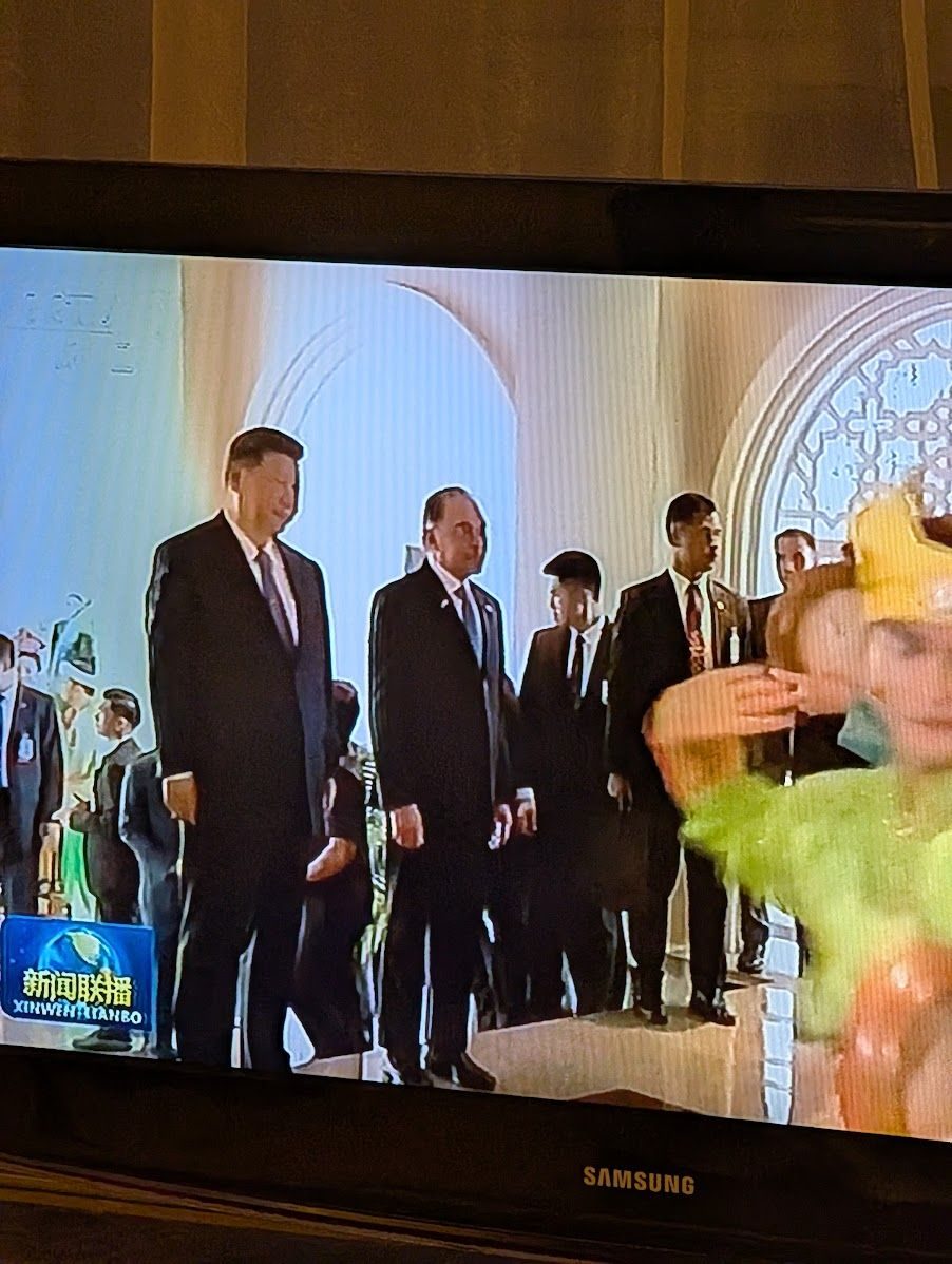 Daddy Xi waiting for me, playing in my hotel room as I walk in